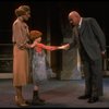 Kristi Coombs as Annie and Reid Shelton as Daddy Warbucks w. Grace in a scene from the New Orleans production of the musical "Annie."