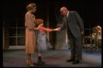 Kristi Coombs as Annie and Reid Shelton as Daddy Warbucks w. Grace in a scene from the New Orleans production of the musical "Annie."