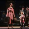 Kristi Coombs as Annie and Reid Shelton as Daddy Warbucks w. Grace in a scene from the New Orleans production of the musical "Annie."