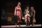 Kristi Coombs as Annie and Reid Shelton as Daddy Warbucks w. Grace in a scene from the New Orleans production of the musical "Annie."