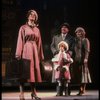 Kristi Coombs as Annie and Reid Shelton as Daddy Warbucks w. Grace in a scene from the New Orleans production of the musical "Annie."