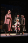 Kristi Coombs as Annie and Reid Shelton as Daddy Warbucks w. Grace in a scene from the New Orleans production of the musical "Annie."