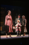 Kristi Coombs as Annie and Reid Shelton as Daddy Warbucks w. Grace in a scene from the New Orleans production of the musical "Annie."