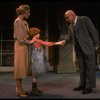 Kristi Coombs as Annie and Reid Shelton as Daddy Warbucks w. Grace in a scene from the New Orleans production of the musical "Annie."
