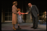 Kristi Coombs as Annie and Reid Shelton as Daddy Warbucks w. Grace in a scene from the New Orleans production of the musical "Annie."