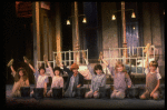 Kristi Coombs as Annie (C) w. orphans in a scene from the New Orleans production of the musical "Annie."