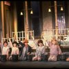 Kristi Coombs as Annie (C) w. orphans in a scene from the New Orleans production of the musical "Annie."