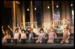 Kristi Coombs as Annie (C) w. orphans in a scene from the New Orleans production of the musical "Annie."