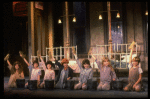 Kristi Coombs as Annie (C) w. orphans in a scene from the New Orleans production of the musical "Annie."