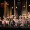 Kristi Coombs as Annie (C) w. orphans in a scene from the New Orleans production of the musical "Annie."