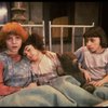 Kristi Coombs as Annie (L) w. orphans in a scene from the New Orleans production of the musical "Annie."