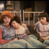 Kristi Coombs as Annie (L) w. orphans in a scene from the New Orleans production of the musical "Annie."