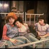 Kristi Coombs as Annie (L) w. orphans in a scene from the New Orleans production of the musical "Annie."