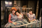 Kristi Coombs as Annie (L) w. orphans in a scene from the New Orleans production of the musical "Annie."