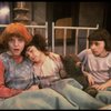 Kristi Coombs as Annie (L) w. orphans in a scene from the New Orleans production of the musical "Annie."