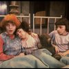 Kristi Coombs as Annie (L) w. orphans in a scene from the New Orleans production of the musical "Annie."