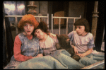 Kristi Coombs as Annie (L) w. orphans in a scene from the New Orleans production of the musical "Annie."