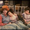 Kristi Coombs as Annie (L) w. orphans in a scene from the New Orleans production of the musical "Annie."
