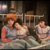 Kristi Coombs as Annie (L) w. orphans in a scene from the New Orleans production of the musical "Annie."