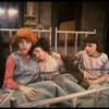 Kristi Coombs as Annie (L) w. orphans in a scene from the New Orleans production of the musical "Annie."