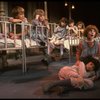 Kristi Coombs as Annie (R) w. orphans in a scene from the New Orleans production of the musical "Annie."