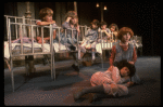 Kristi Coombs as Annie (R) w. orphans in a scene from the New Orleans production of the musical "Annie."