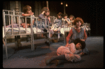 Kristi Coombs as Annie (R) w. orphans in a scene from the New Orleans production of the musical "Annie."