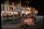 Kristi Coombs as Annie (R) w. orphans in a scene from the New Orleans production of the musical "Annie."