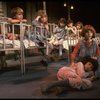 Kristi Coombs as Annie (R) w. orphans in a scene from the New Orleans production of the musical "Annie."