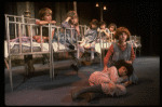 Kristi Coombs as Annie (R) w. orphans in a scene from the New Orleans production of the musical "Annie."