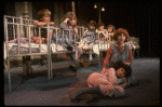 Kristi Coombs as Annie (R) w. orphans in a scene from the New Orleans production of the musical "Annie."
