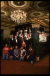 Entire cast posing in lobby of theatre of the New Orleans production of the musical "Annie."