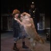 Kristi Coombs as Annie w. Sandy and a policeman in a scene from the New Orleans production of the musical "Annie."