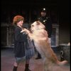 Kristi Coombs as Annie w. Sandy and a policeman in a scene from the New Orleans production of the musical "Annie."