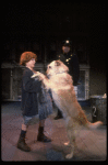 Kristi Coombs as Annie w. Sandy and a policeman in a scene from the New Orleans production of the musical "Annie."