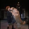 Kristi Coombs as Annie w. Sandy and a policeman in a scene from the New Orleans production of the musical "Annie."