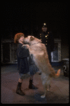 Kristi Coombs as Annie w. Sandy and a policeman in a scene from the New Orleans production of the musical "Annie."