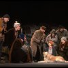 Kristi Coombs as Annie w. Sandy and Hooverville-ites in a scene from the New Orleans production of the musical "Annie."