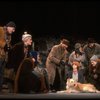 Kristi Coombs as Annie w. Sandy and Hooverville-ites in a scene from the New Orleans production of the musical "Annie."