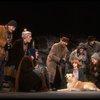 Kristi Coombs as Annie w. Sandy and Hooverville-ites in a scene from the New Orleans production of the musical "Annie."