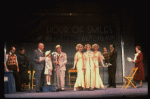 Kristi Coombs as Annie (4L) and Reid Shelton as Daddy Warbucks (3L) in a scene from a touring company of the musical "Annie." (New Orleans)