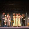 Kristi Coombs as Annie (4L) and Reid Shelton as Daddy Warbucks (3L) in a scene from a touring company of the musical "Annie." (New Orleans)