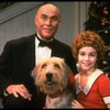 Roseanne Sorrentino as Annie and Harve Presnell as Daddy Warbucks w. Sandy in a scene from the touring company of the musical "Annie." (Louisville)