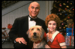 Roseanne Sorrentino as Annie and Harve Presnell as Daddy Warbucks w. Sandy in a scene from the touring company of the musical "Annie." (Louisville)