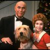 Roseanne Sorrentino as Annie and Harve Presnell as Daddy Warbucks w. Sandy in a scene from the touring company of the musical "Annie." (Louisville)