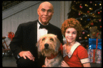 Roseanne Sorrentino as Annie and Harve Presnell as Daddy Warbucks w. Sandy in a scene from the touring company of the musical "Annie." (Louisville)