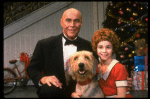 Roseanne Sorrentino as Annie and Harve Presnell as Daddy Warbucks w. Sandy in a scene from the touring company of the musical "Annie." (Louisville)