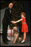 Roseanne Sorrentino as Annie and Harve Presnell as Daddy Warbucks w. Sandy in a scene from the touring company of the musical "Annie." (Louisville)