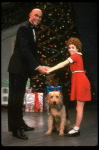 Roseanne Sorrentino as Annie and Harve Presnell as Daddy Warbucks w. Sandy in a scene from the touring company of the musical "Annie." (Louisville)