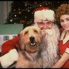 Roseanne Sorrentino as Annie w. Santa Claus and Sandy in a scene from the touring company of the musical "Annie." (Louisville)